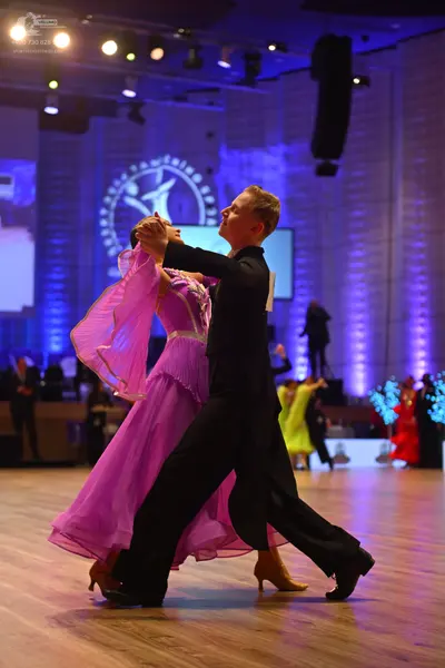 Dancesport competitor: Male dancer: black ballroom suit