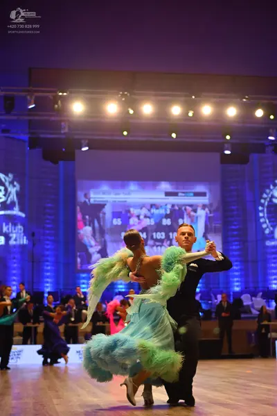 Dancesport competitor: Male dancer: black long-sleeved shirt and black trousers