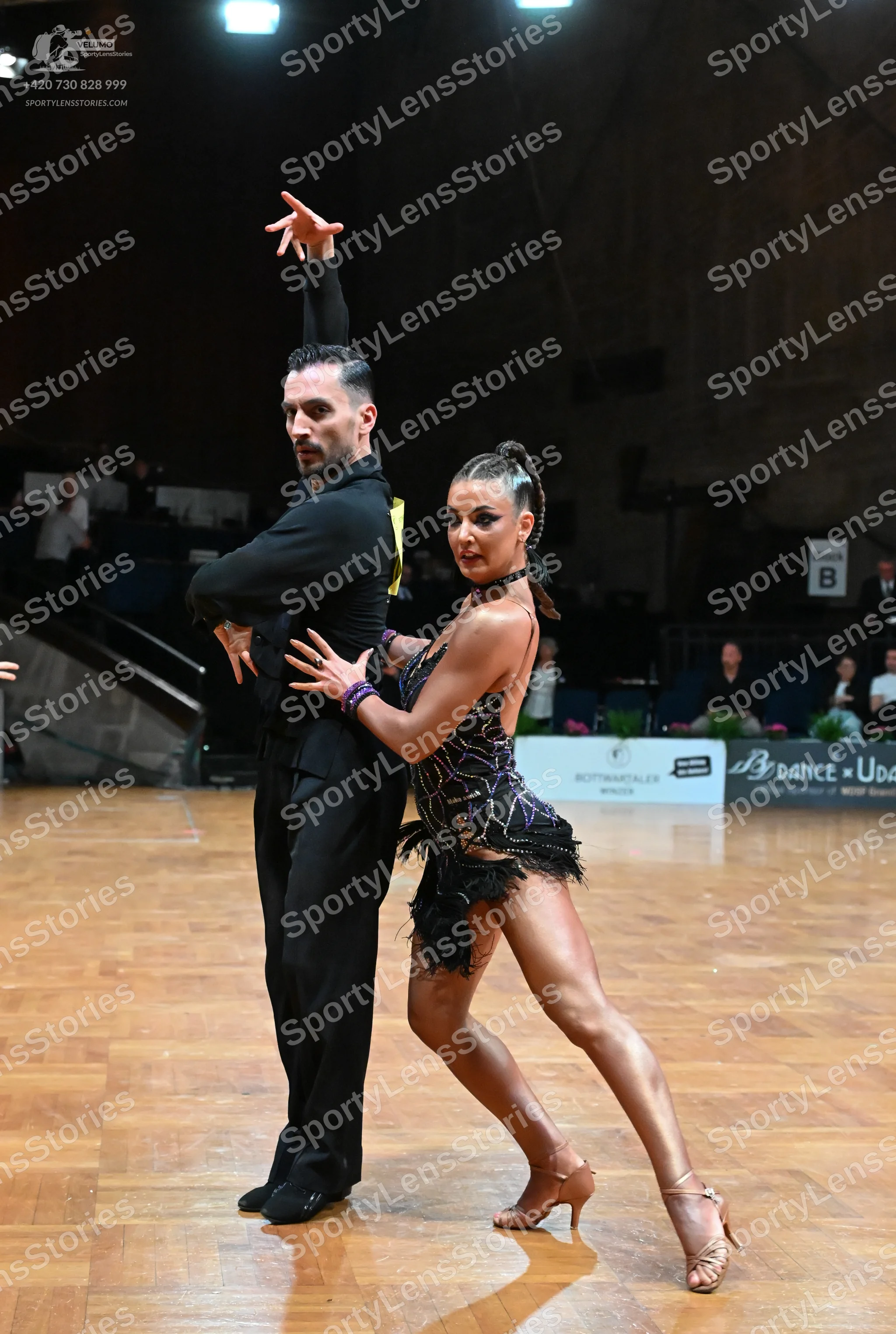 Dancesport competitor: Male dancer: black long-sleeved shirt and black trousers