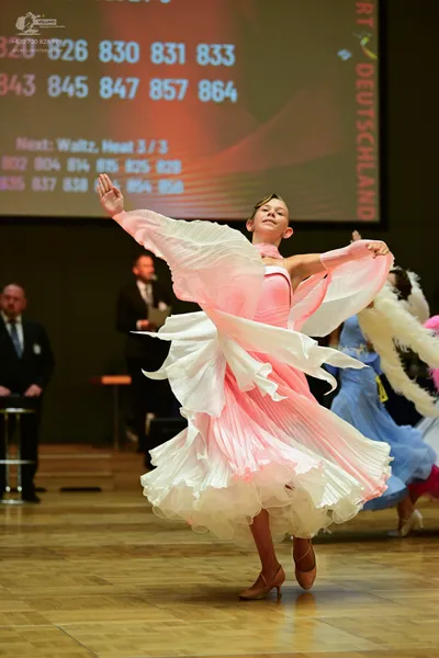 Dancesport competitor: ** Ballgown
*   **Color:** Pale Pink
*   **Fabric:** Satin (likely with a textur
