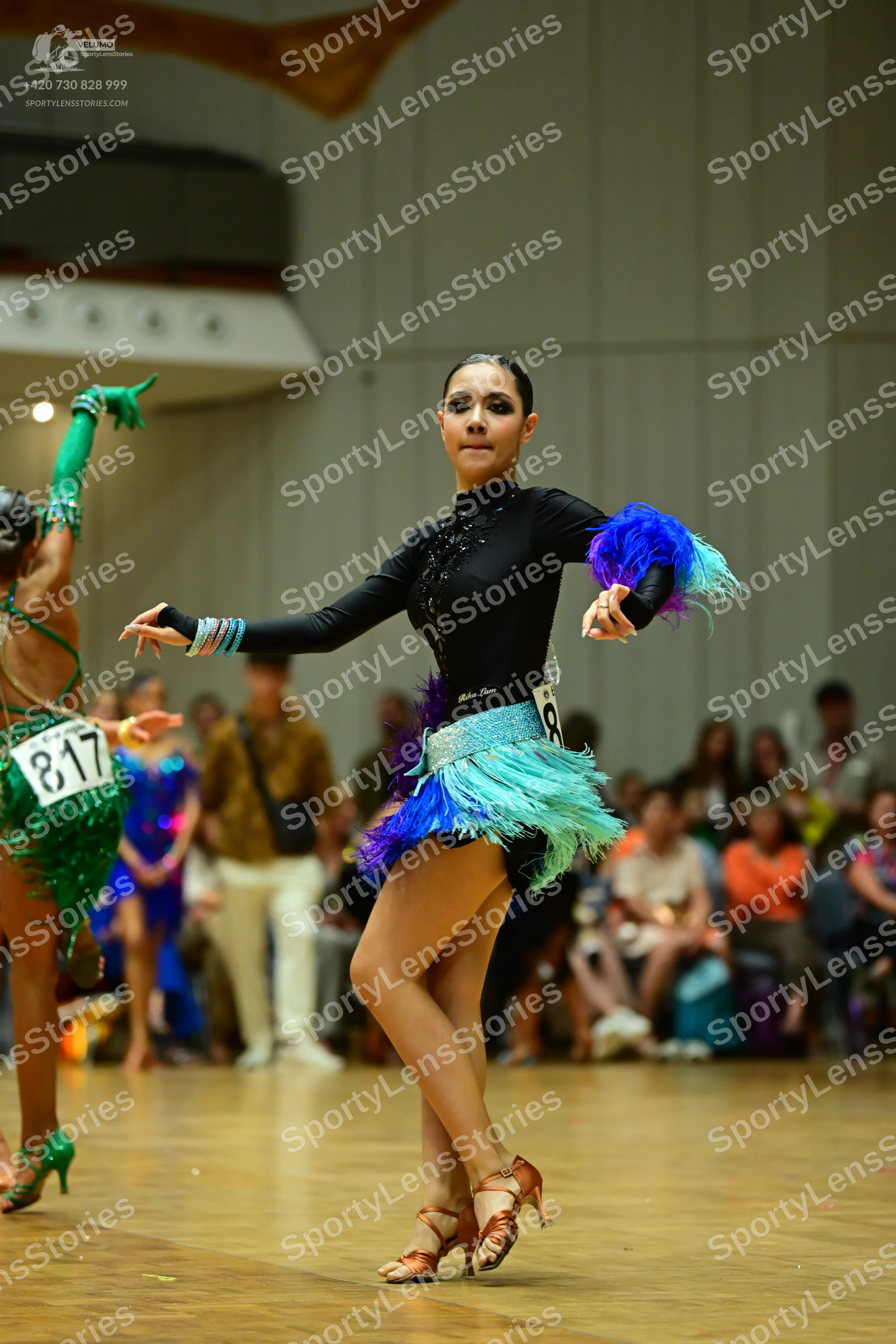 Dancesport competitor #817: Female dancer in green: green Latin dress with sequins and fringe
