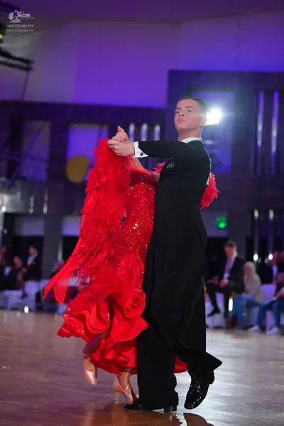 Dancesport competitor: Male dancer: black suit