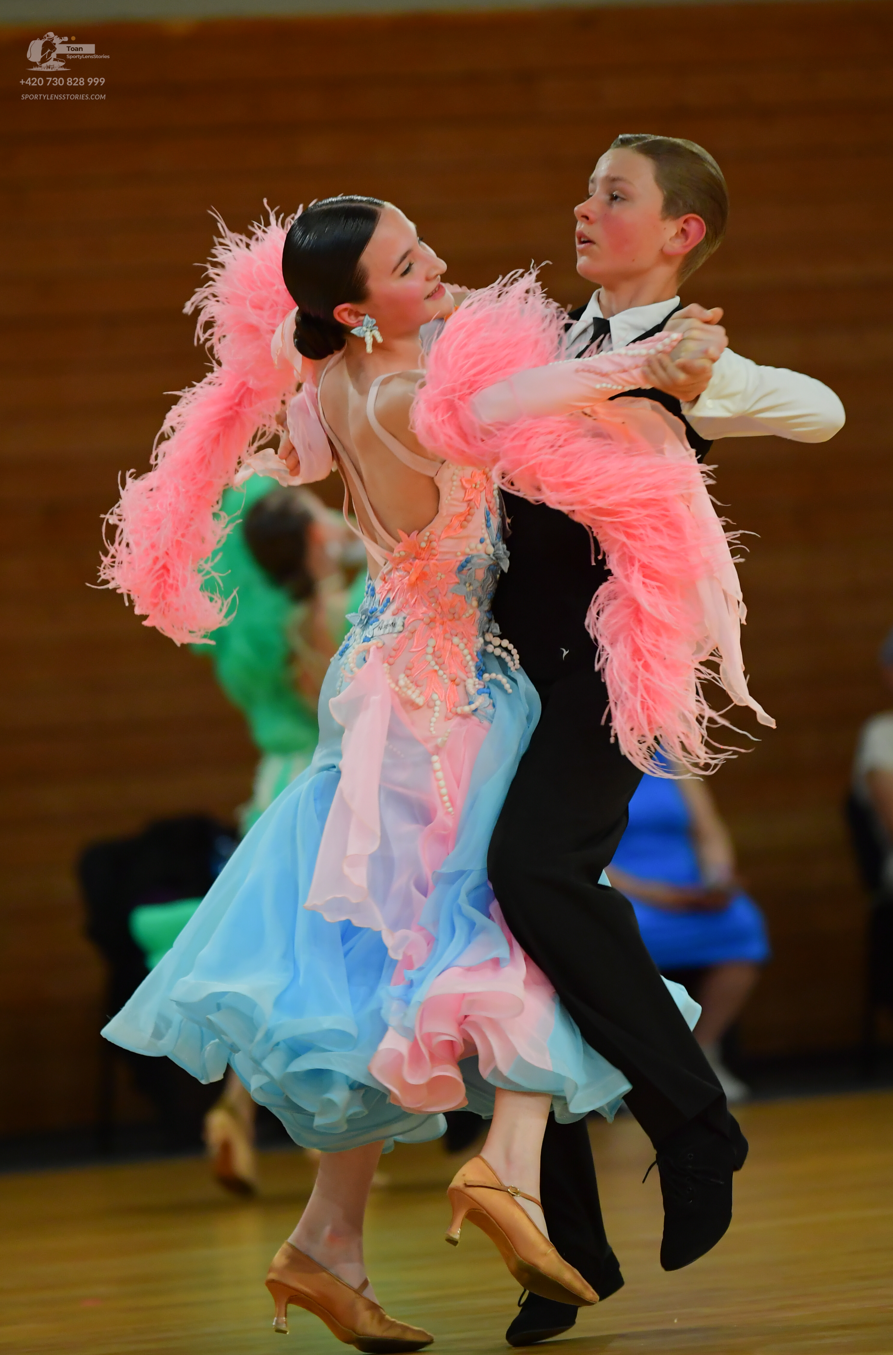 Dancesport competitor: ** Black tailsuit
*   **Fabric:** Darkest black satin
*   **Style:** Tailored su