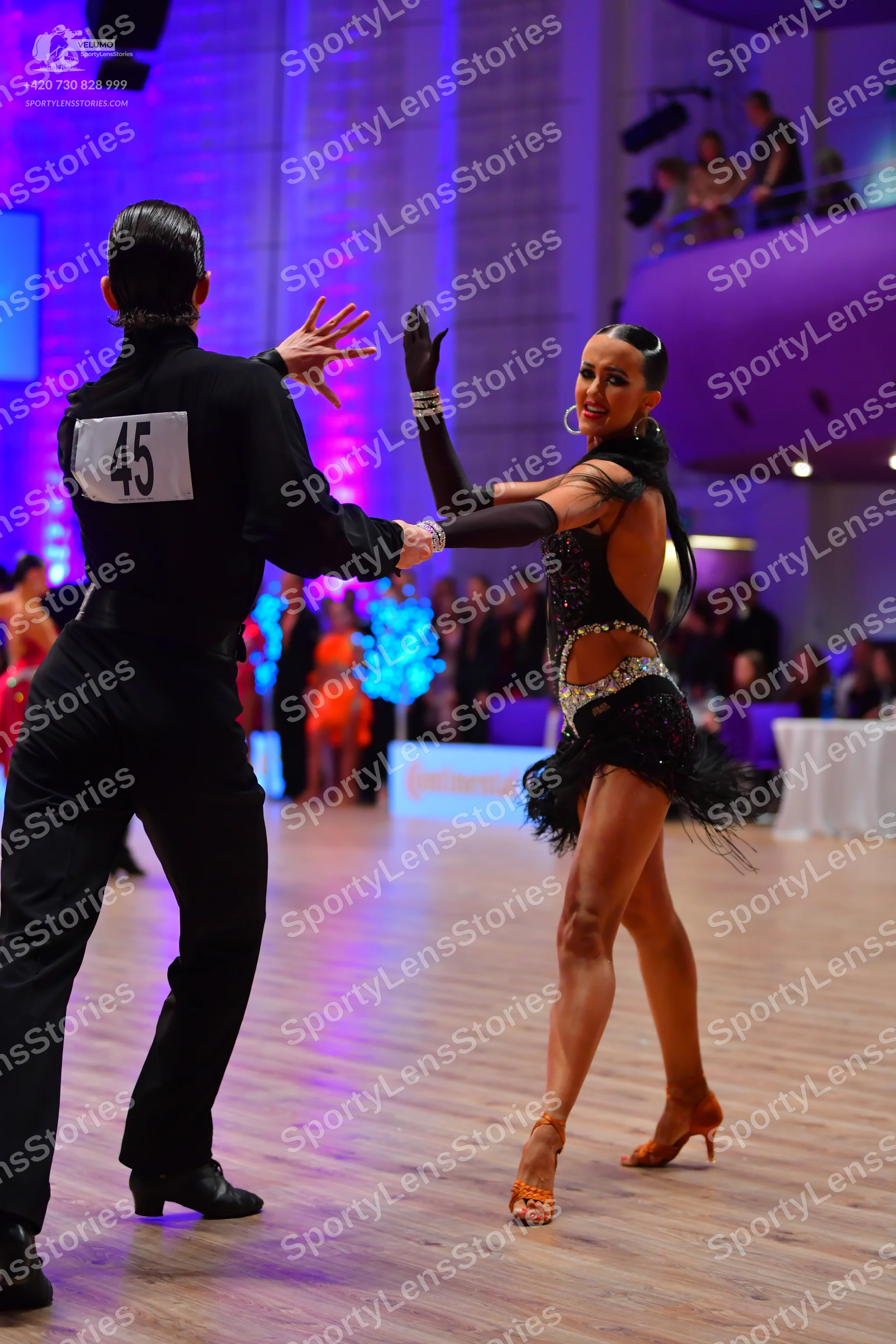 Dancesport competitor: Male dancer: black long-sleeved top and black trousers