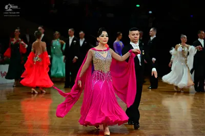 Dancesport competitor: Male dancers: black suits with white shirts