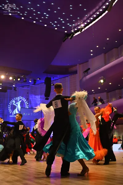 Dancesport competitor: Male dancer: black suit
