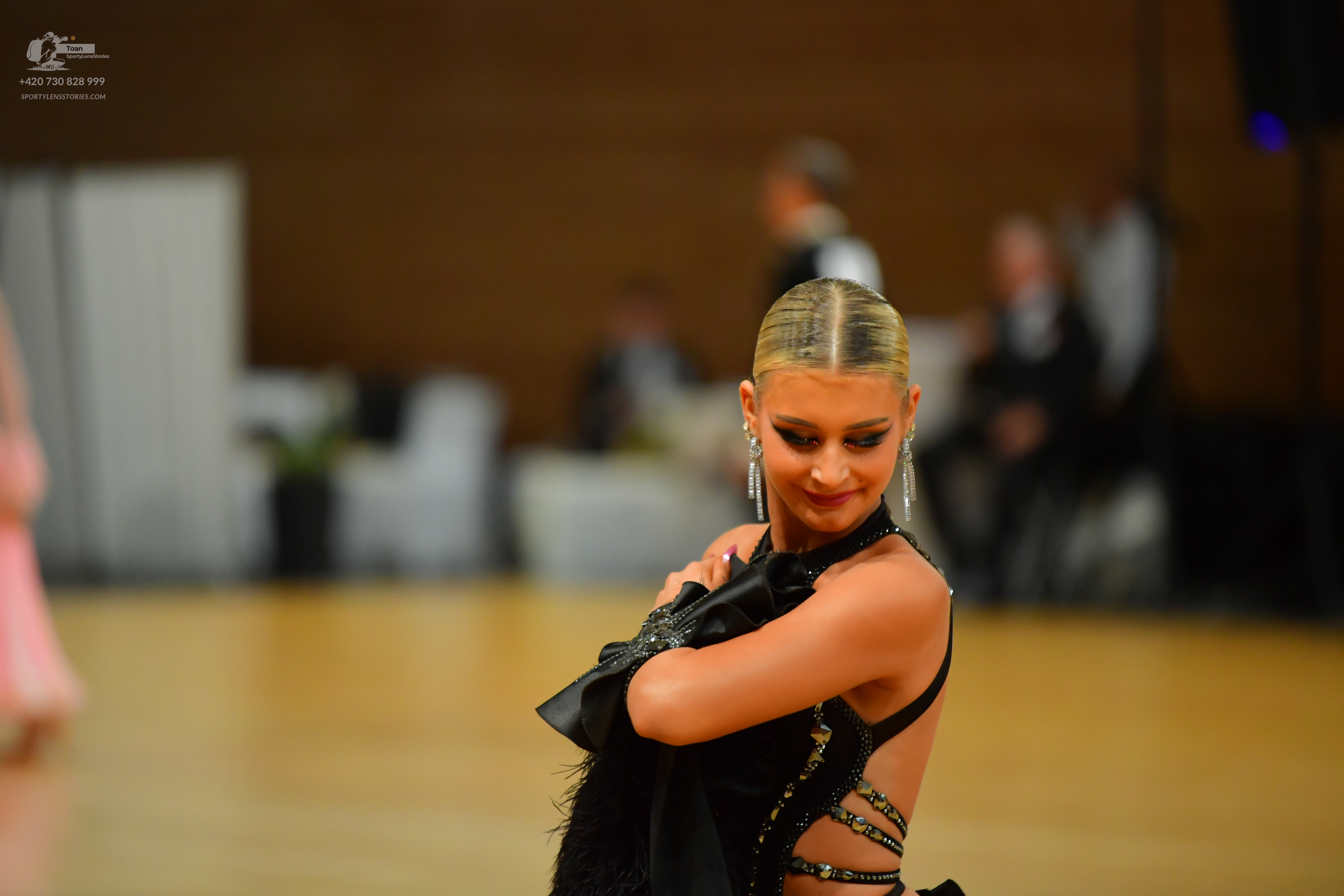 Dancesport competitor: ** Black Latin Dress
*   **Color:** Black
*   **Fabric:** Primarily sequins with