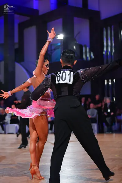 Dancesport competitor #601: Male dancer: black long-sleeved shirt with sequins and black trousers