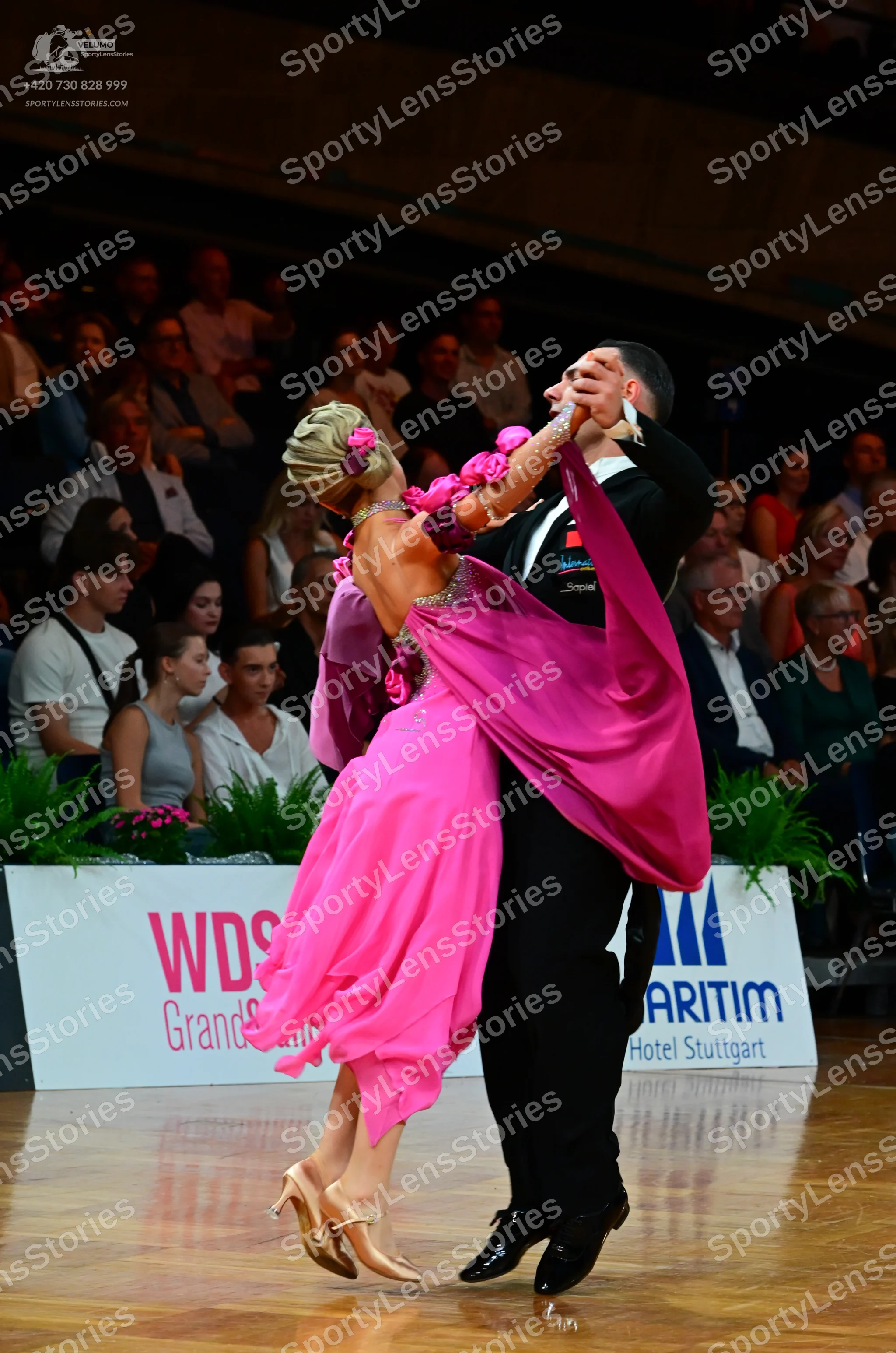 Dancesport competitor: Male dancer: black suit with a waistcoat and trousers, and black dance shoes