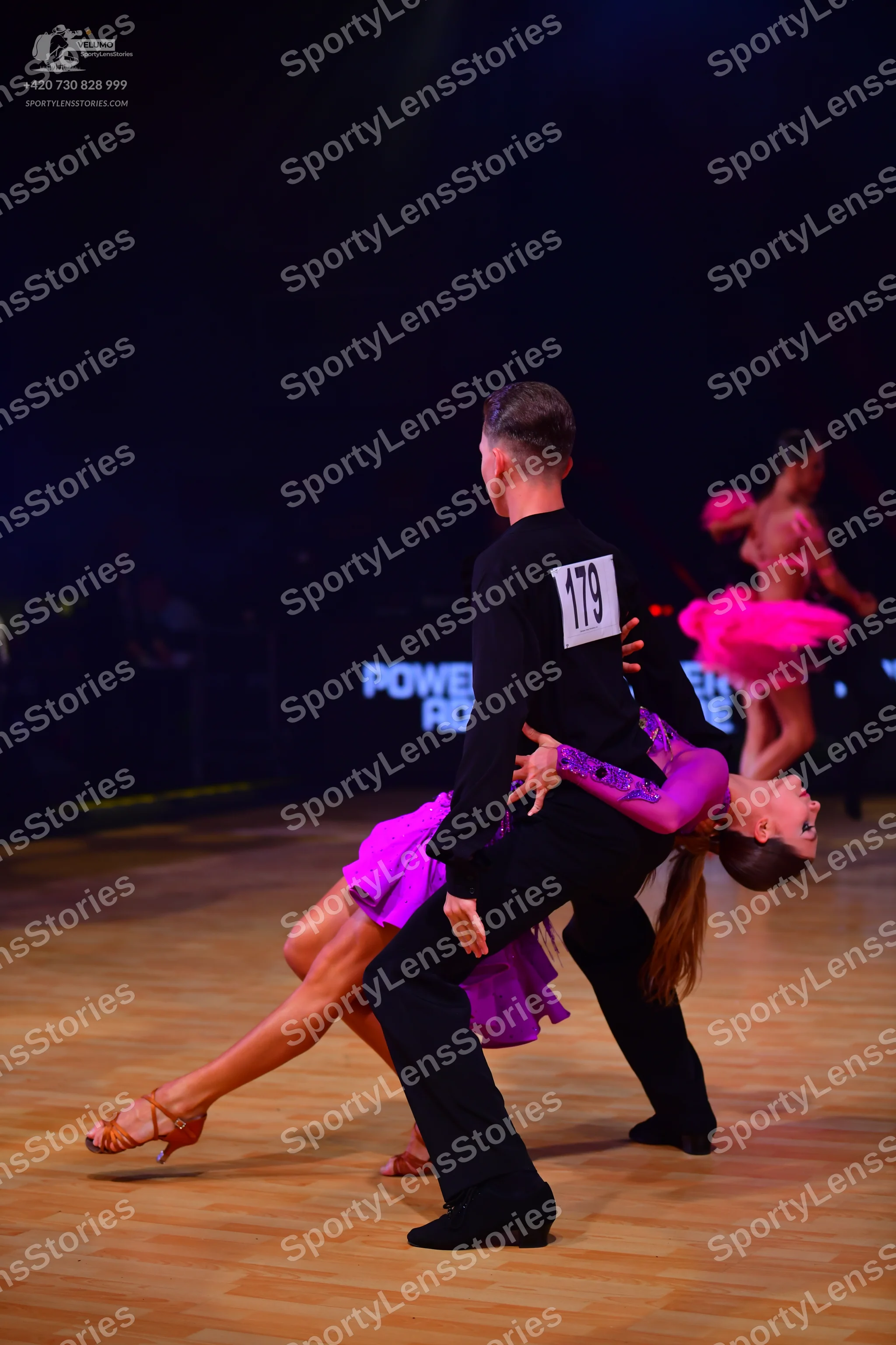 Dancesport competitor: Male dancer: black long-sleeved shirt and black trousers