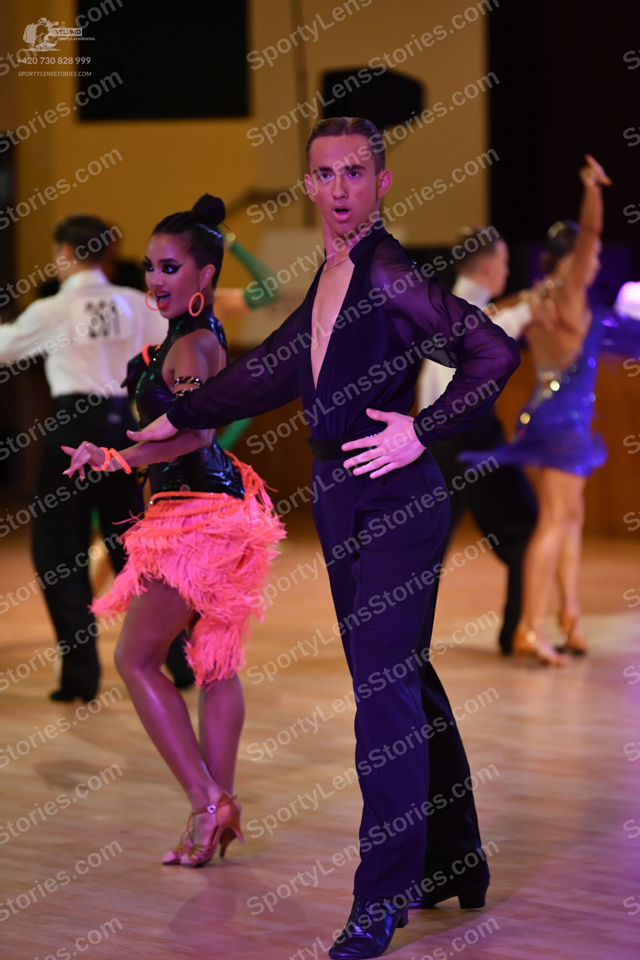 Dancesport competitor: ** Black tailsuit with sequin lapels