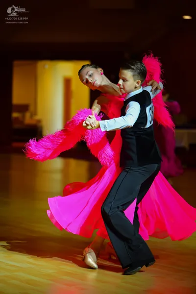Dancesport competitor #38: Male dancer: black waistcoat, white long-sleeved shirt, and black trousers