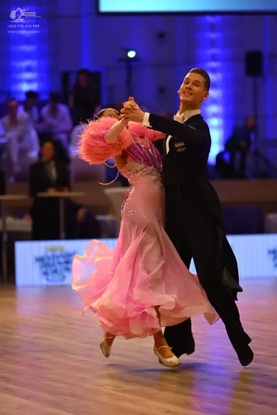 Dancesport competitor: Male dancer: black ballroom suit