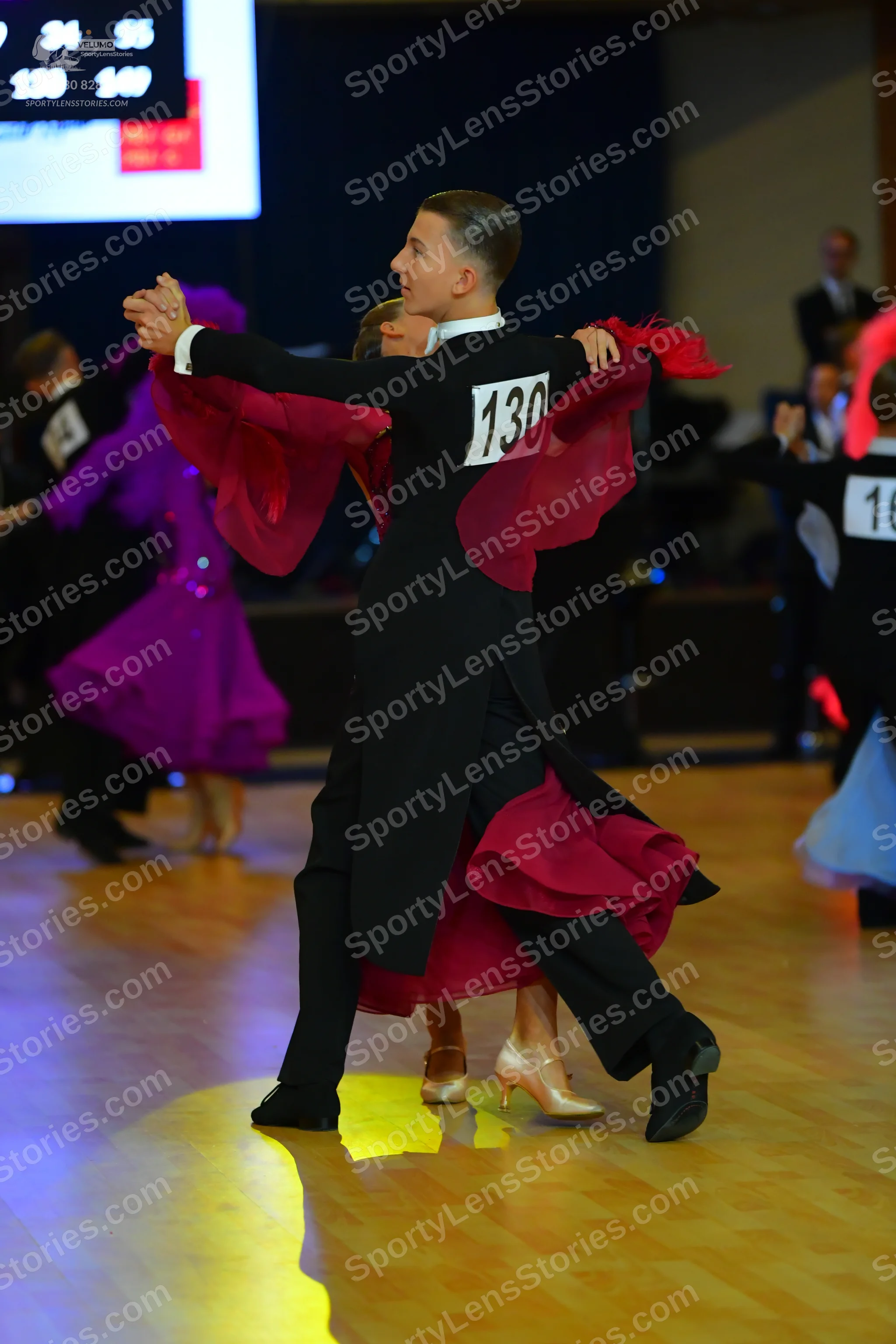 Dancesport competitor #130, #16: Male dancer: black ballroom suit with black trousers