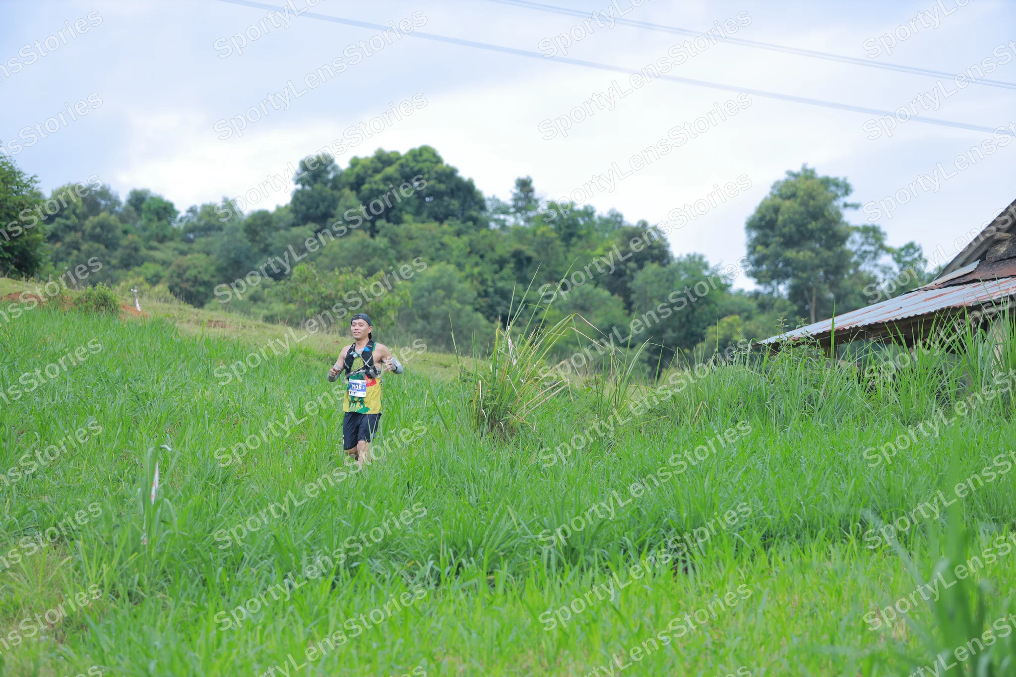 Marathon runner: Runner 1: yellow and green tank top, black shorts, hydration vest