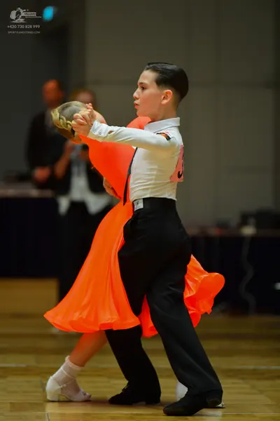 Dancesport competitor #36: Male dancer: white long-sleeved shirt and black trousers