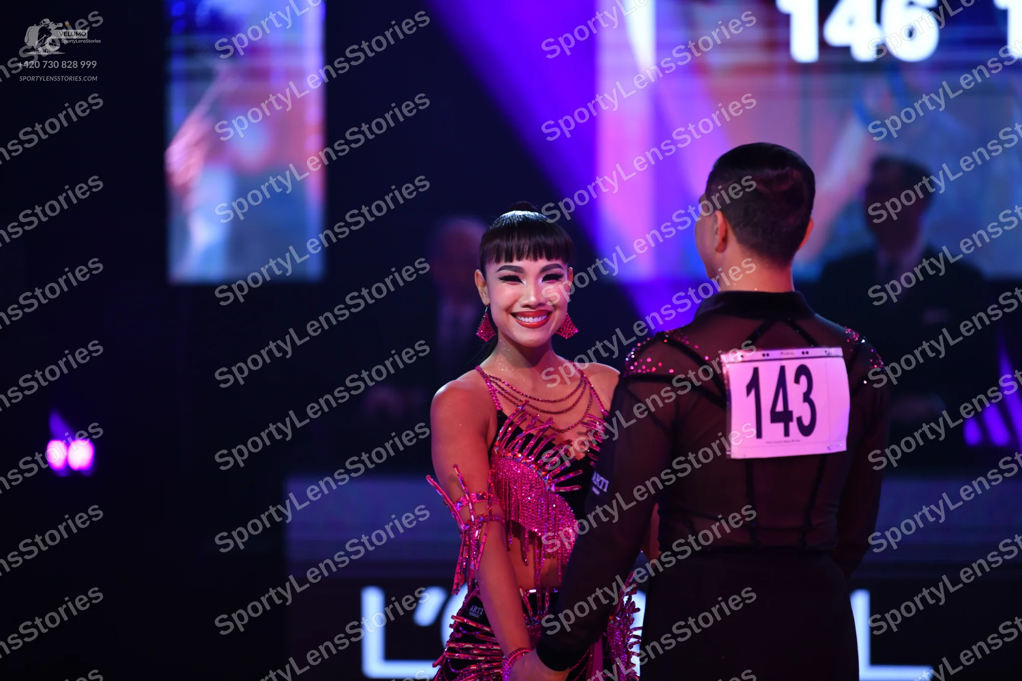 Dancesport competitor: Male dancer: black latin dance top with sheer mesh panels and small sequins
