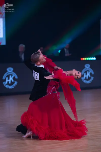 Dancesport competitor: Male dancer: black ballroom suit with a white shirt