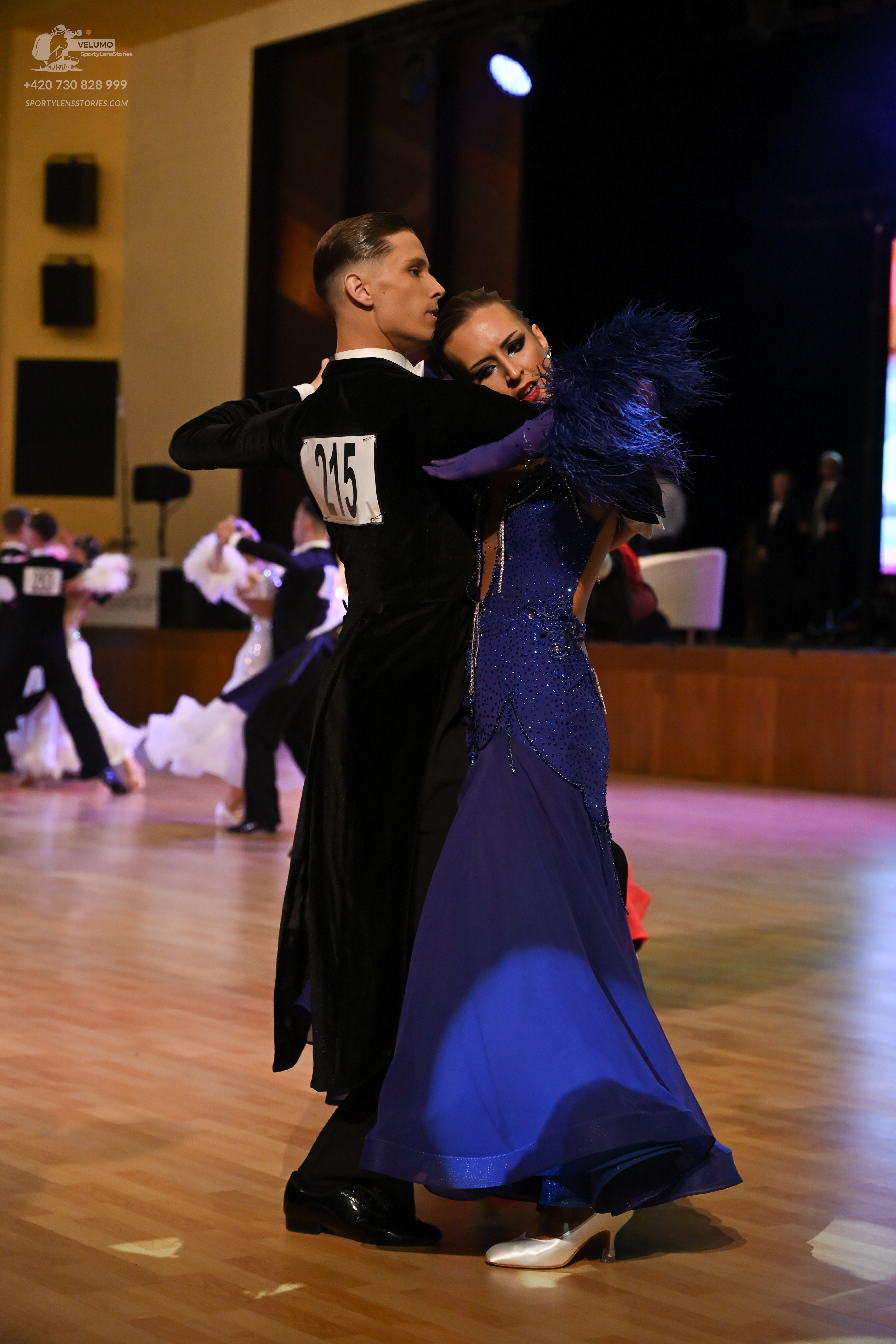 Dancesport competitor: ** Black tail suit with shimmering silver sequin lapels and cuffs