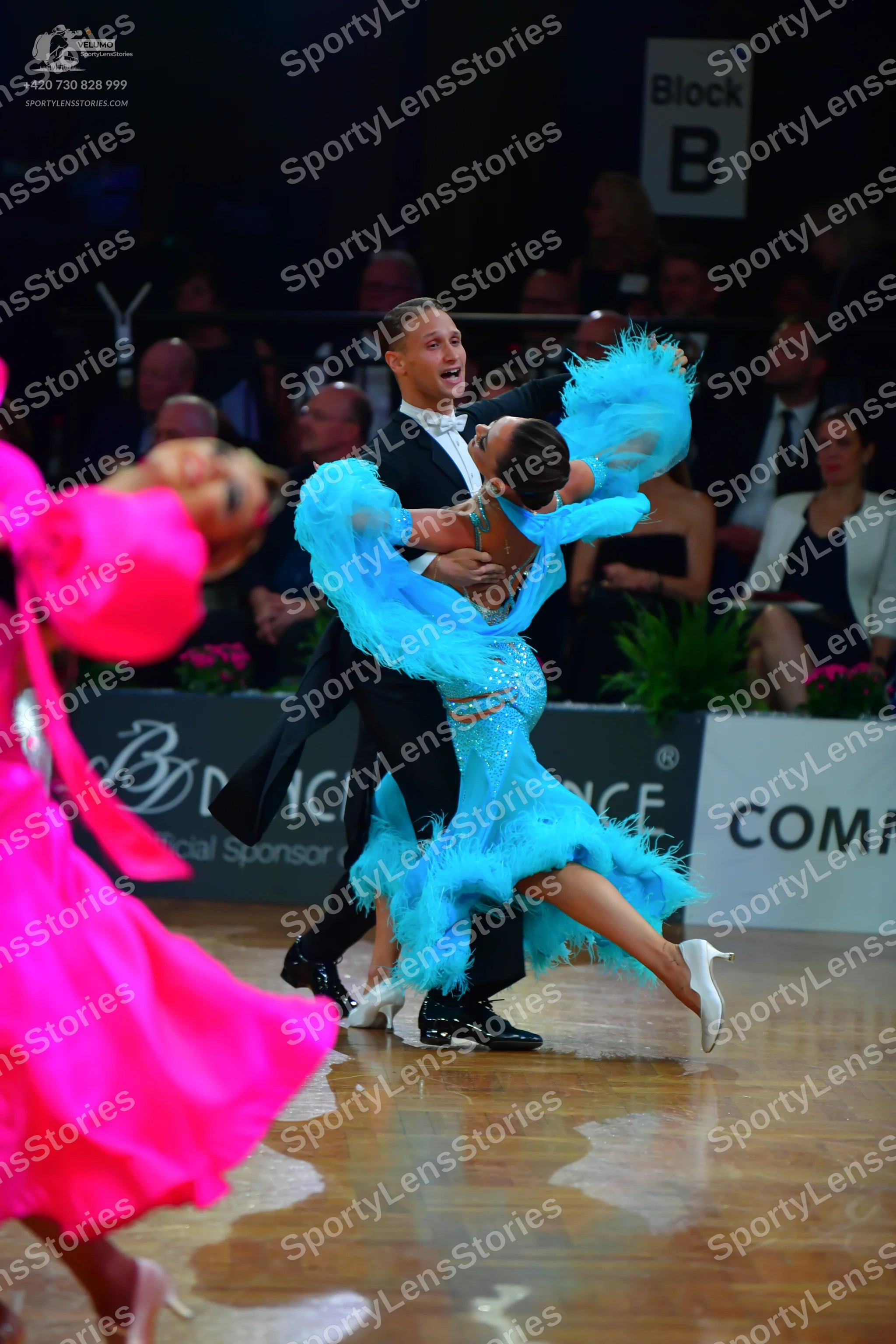 Dancesport competitor: Male dancer: black suit with a white shirt and white bow tie