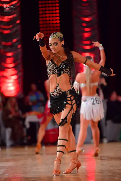Dancesport competitor #269: Female dancer in foreground: leopard print latin dance costume with black sequin