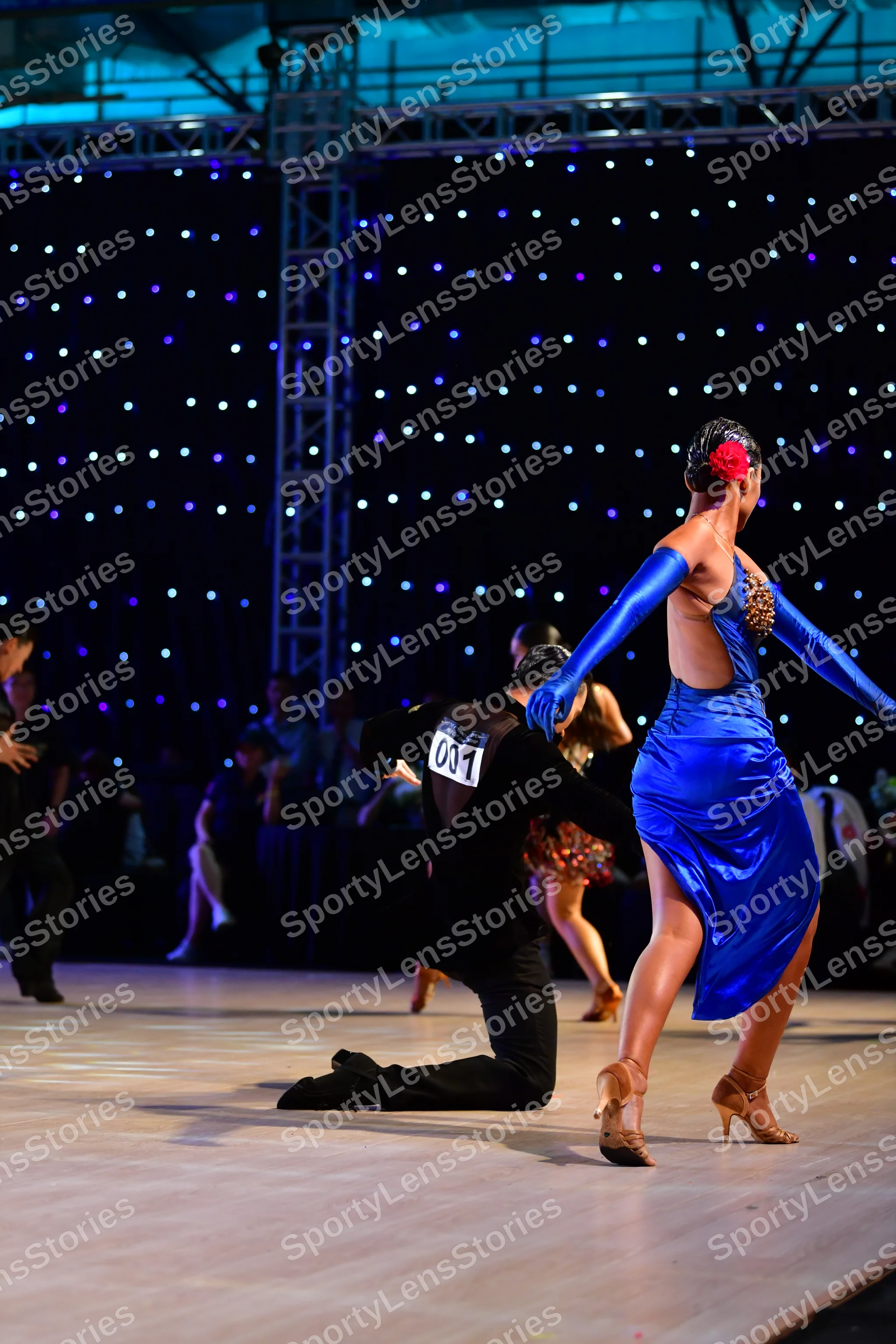 Dancesport competitor: Male:** Black tailsuit with sequin lapels and a white shirt