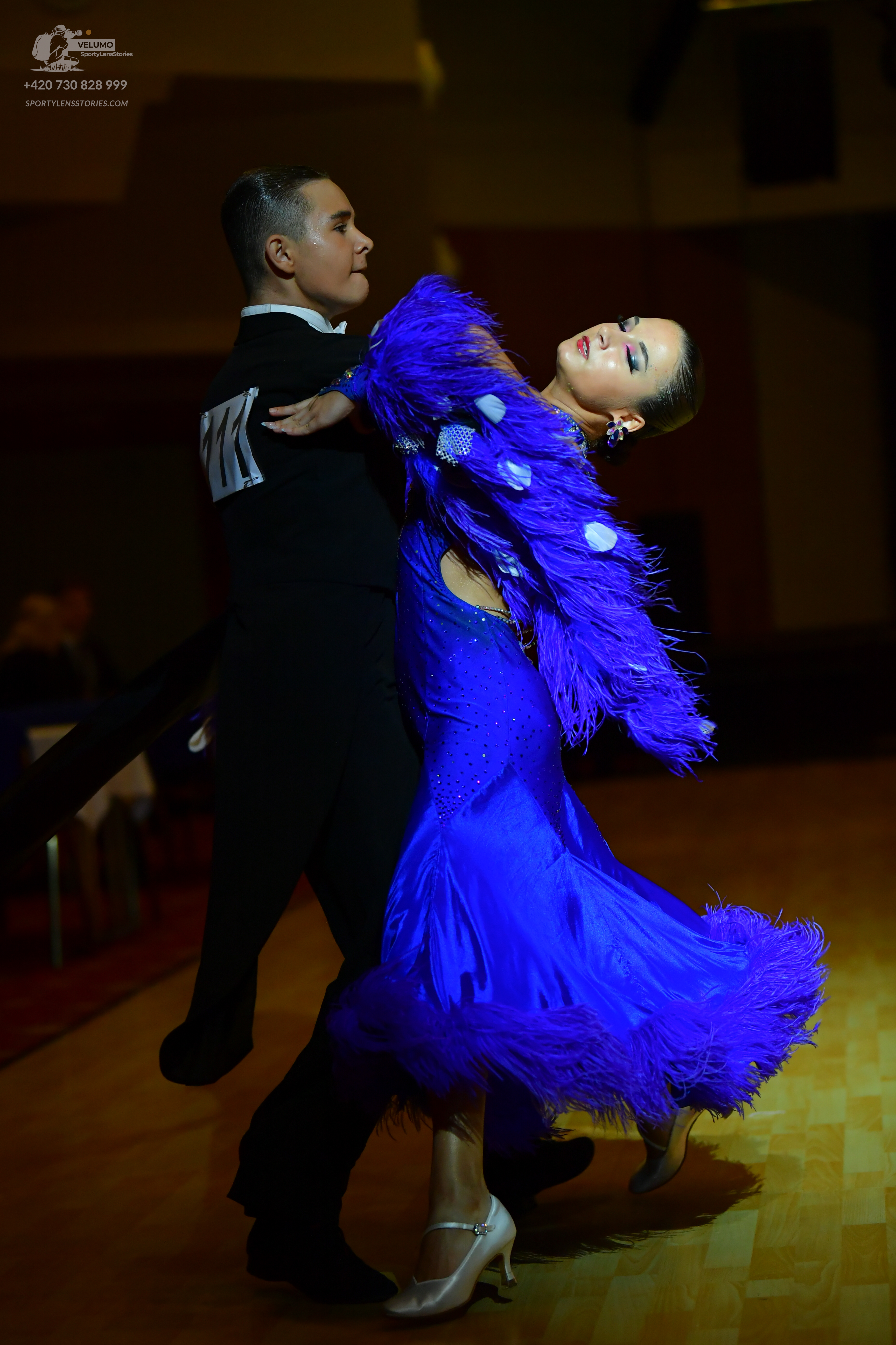 Dancesport competitor: Male dancer: black suit with white/silver detail on the sleeve