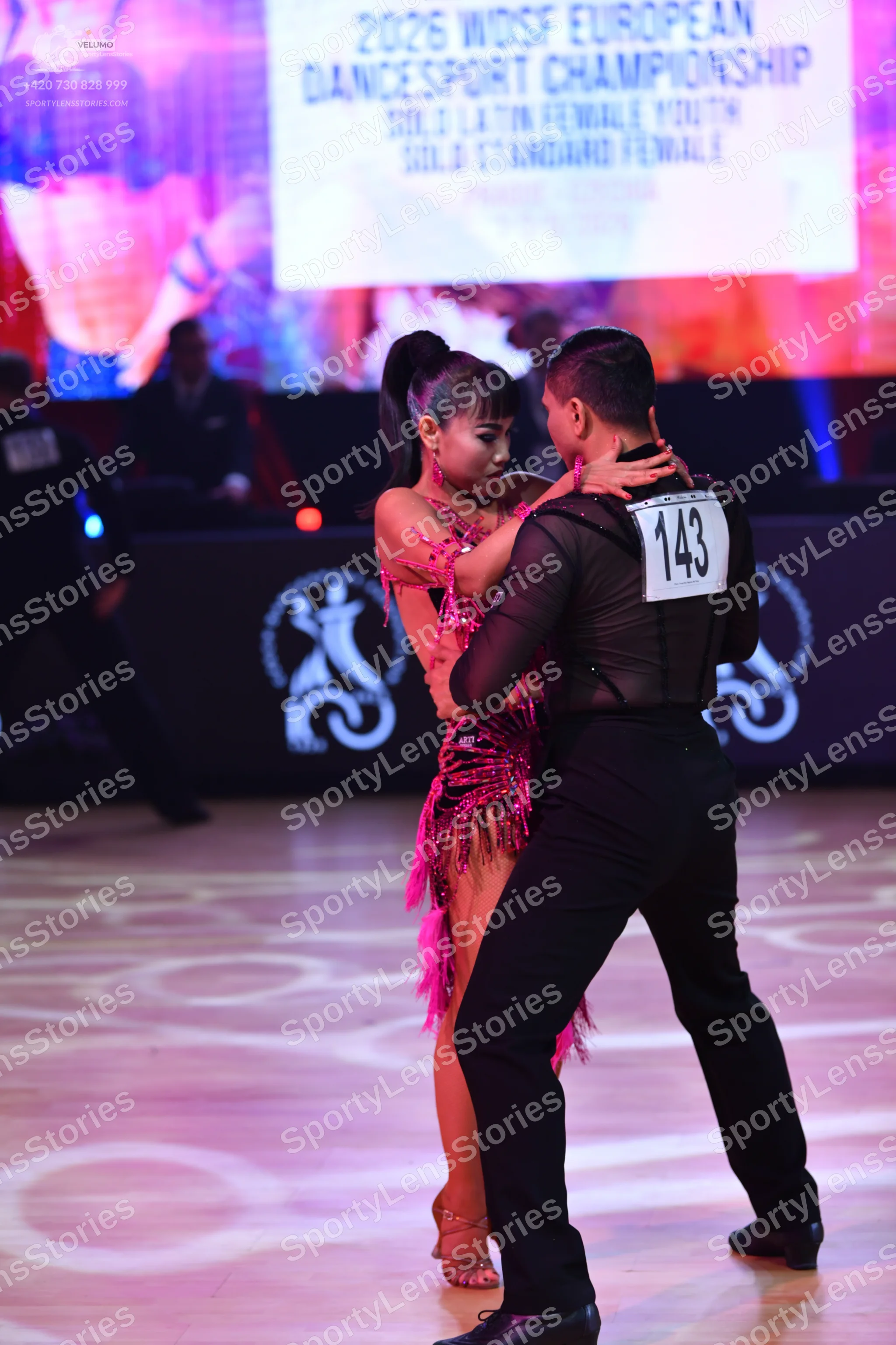 Dancesport competitor: Male dancer: black long-sleeved top and black trousers