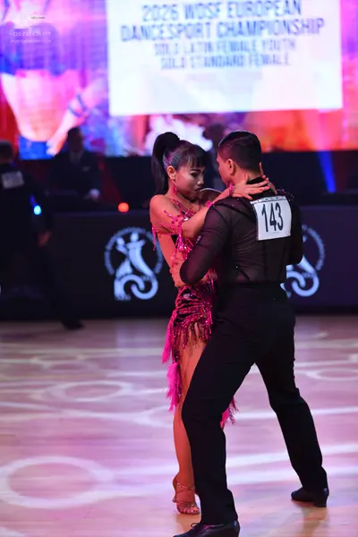 Dancesport competitor: Male dancer: black long-sleeved top and black trousers