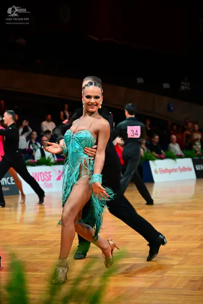 Dancesport competitor #34: Female dancer: teal latin dress with fringe