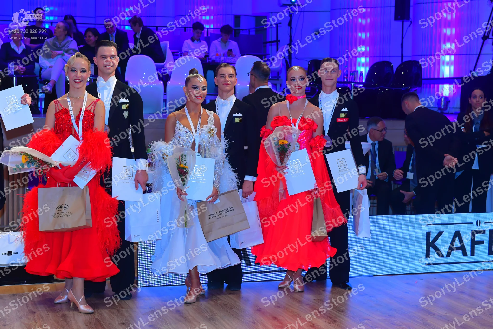 Dancesport competitor: Male dancers: black suits, white shirts, and black ties