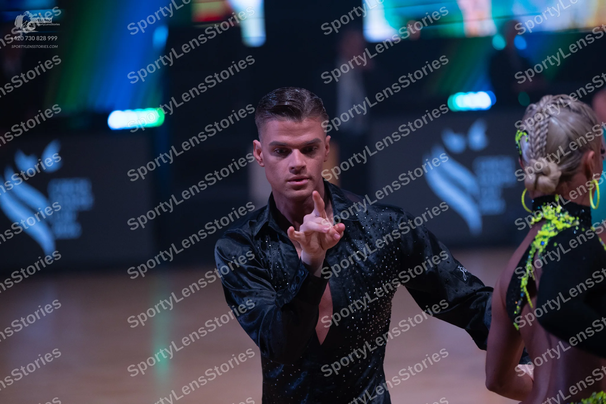 Dancesport competitor: Male dancer: black long-sleeved latin shirt with small crystals or sequins