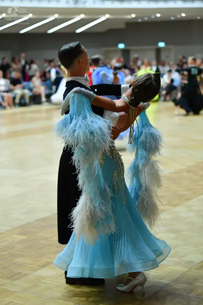 Dancesport competitor: Male dancer: black suit