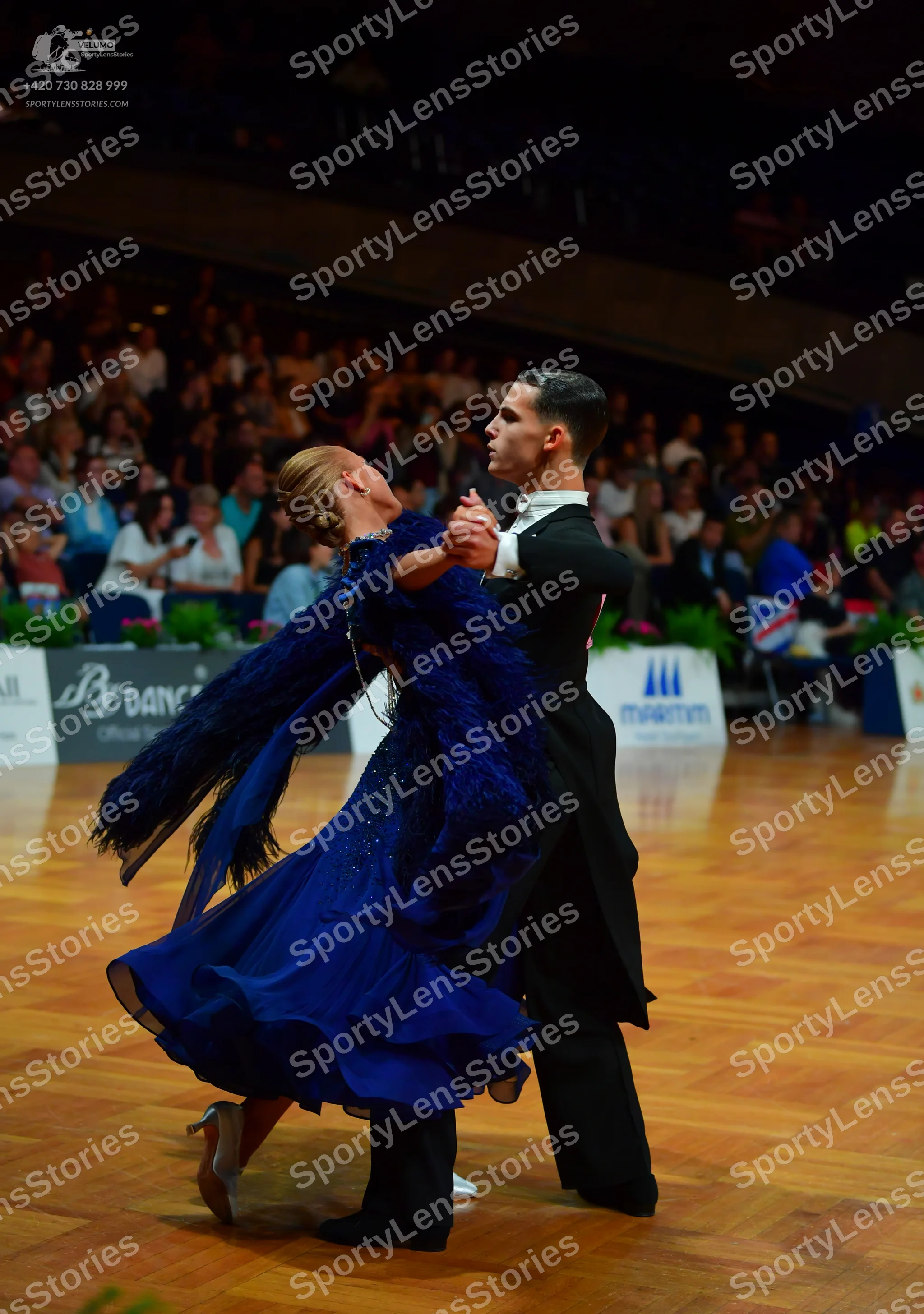 Dancesport competitor: Male dancer: black ballroom tailcoat with a white shirt and collar
