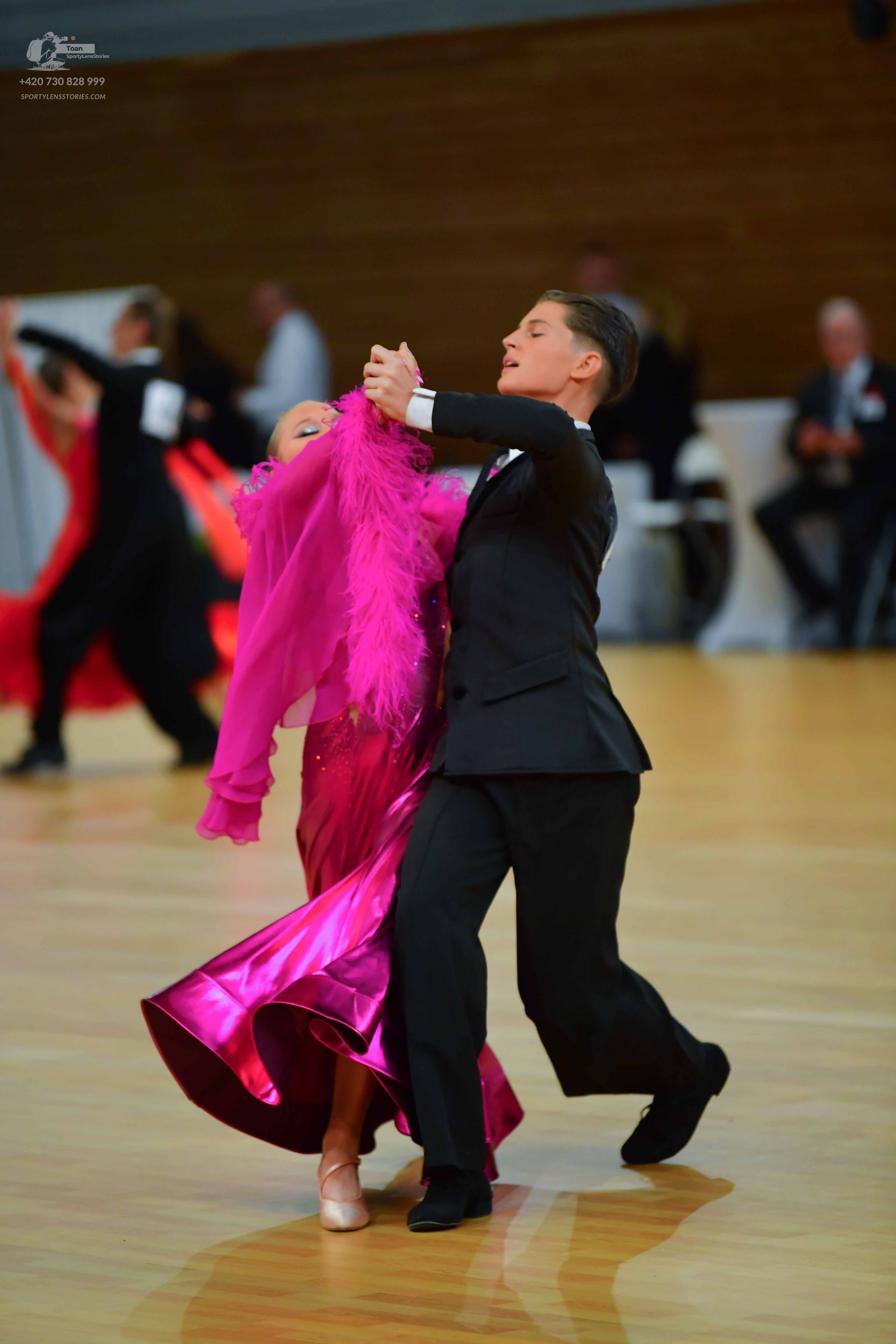 Dancesport competitor: Male**
*   **Color:** Black
*   **Fabric:** Satin (appears to be a satin lapel w