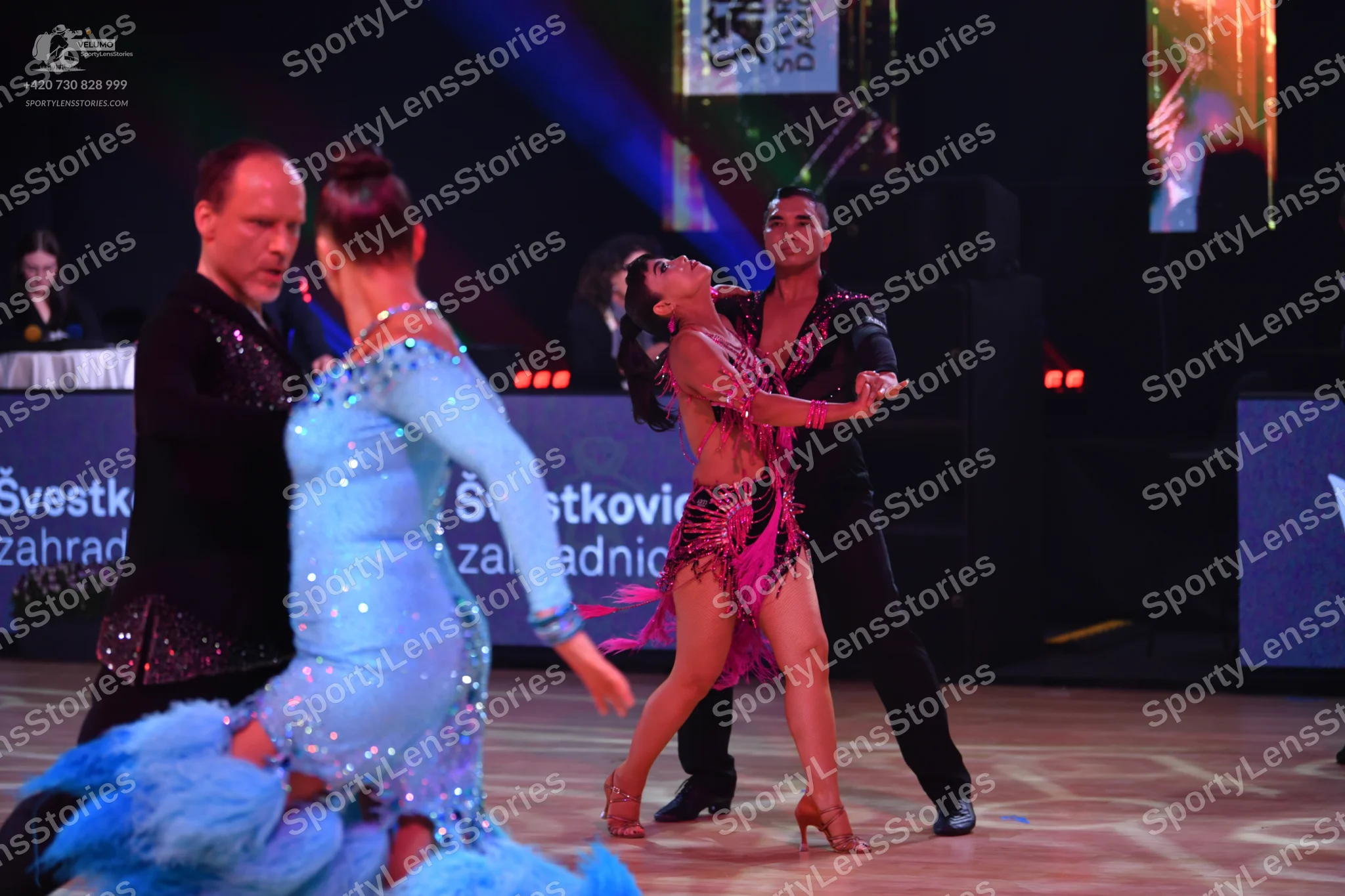 Dancesport competitor: Male dancer (left): black long-sleeved shirt