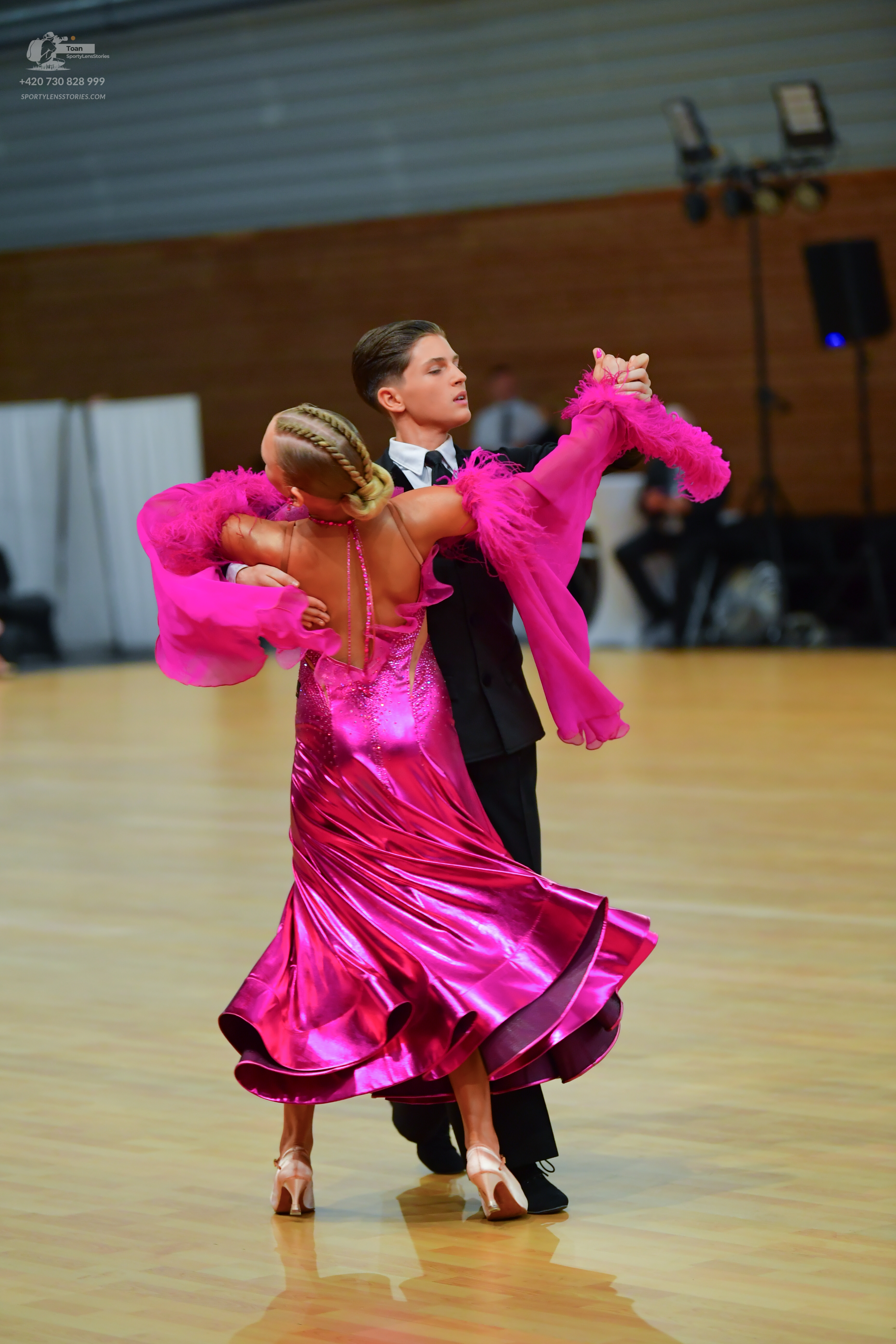 Dancesport competitor: Male:** Black tail suit with silver sequin lapels and a black bow tie