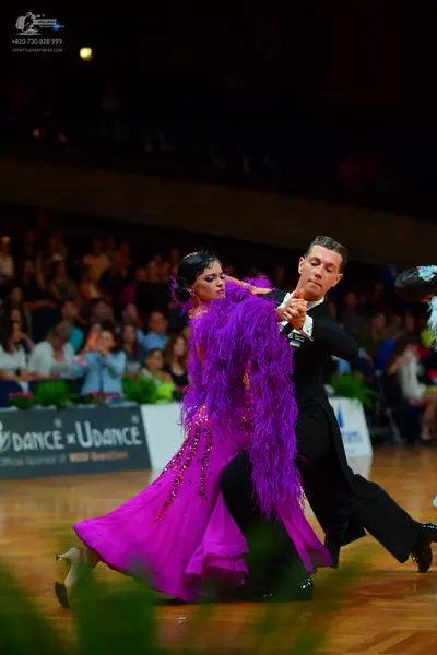 Dancesport competitor: Male dancer: black suit with white shirt and black bow tie