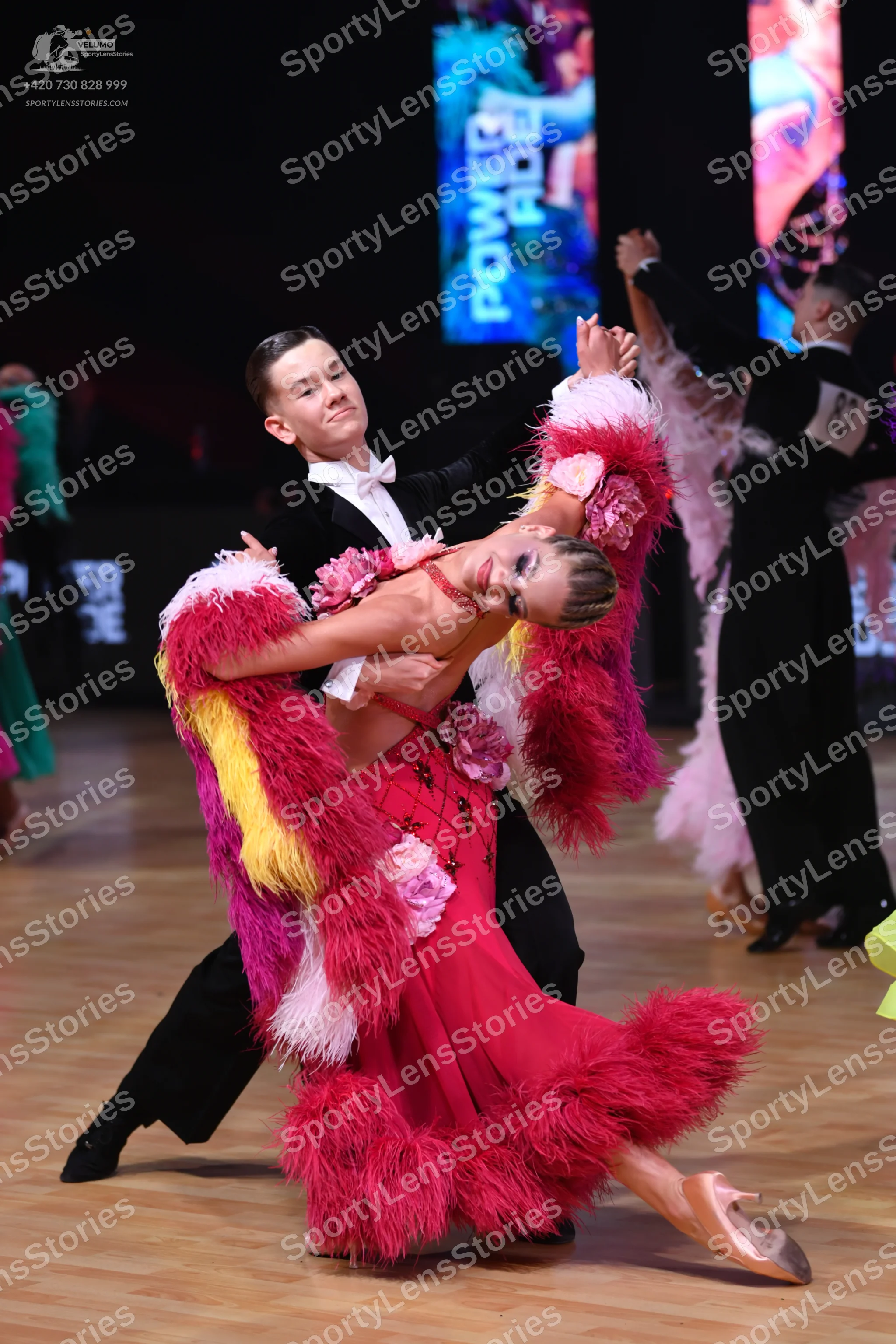 Dancesport competitor: Male dancer: black suit, white shirt, and white bow tie