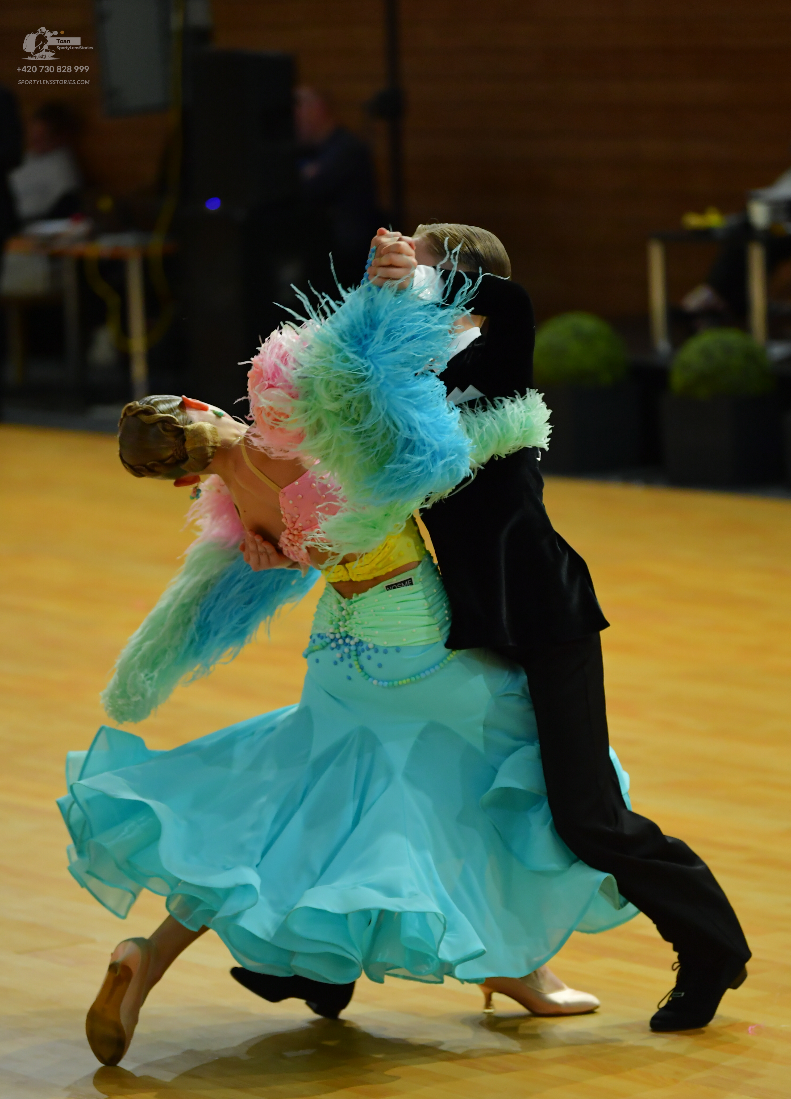 Dancesport competitor: ** Light blue, flowing Latin dress