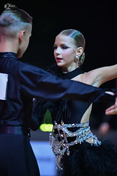 Dancesport competitor: Male dancer: black long-sleeved shirt
