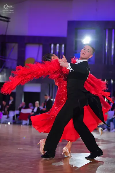 Dancesport competitor: Male dancer: black suit and black dance shoes