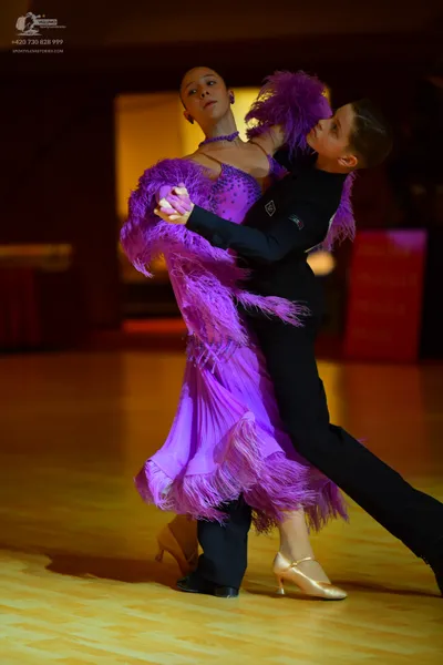 Dancesport competitor: Male dancer: black long-sleeve dance shirt and black trousers with black dance s