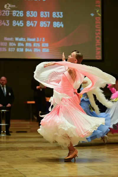 Dancesport competitor #320: ** Pink/Peach Latin Dress 864
*   **Color:** Light Pink/Peach
*   **Fabric:** Sa