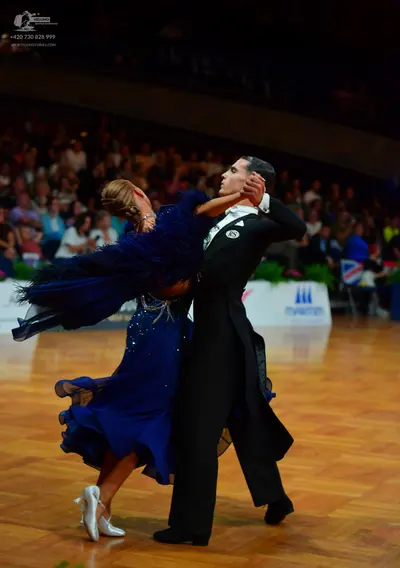 Dancesport competitor: Male dancer: black ballroom tailcoat, white shirt, and black bowtie