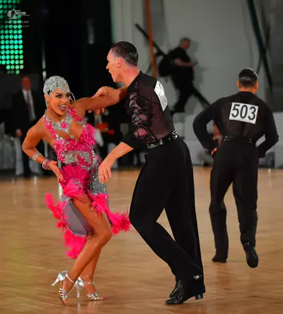 Dancesport competitor #503: Female dancer: pink and silver latin dance dress with heavy silver sequin and cr