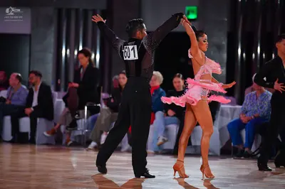Dancesport competitor #601: Male dancer: black long-sleeved shirt and black trousers