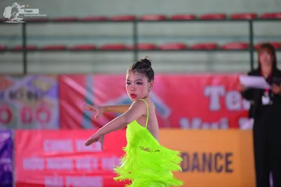 Dancesport competitor: ** Female: Bright Green, short, shimmering, fringed dress