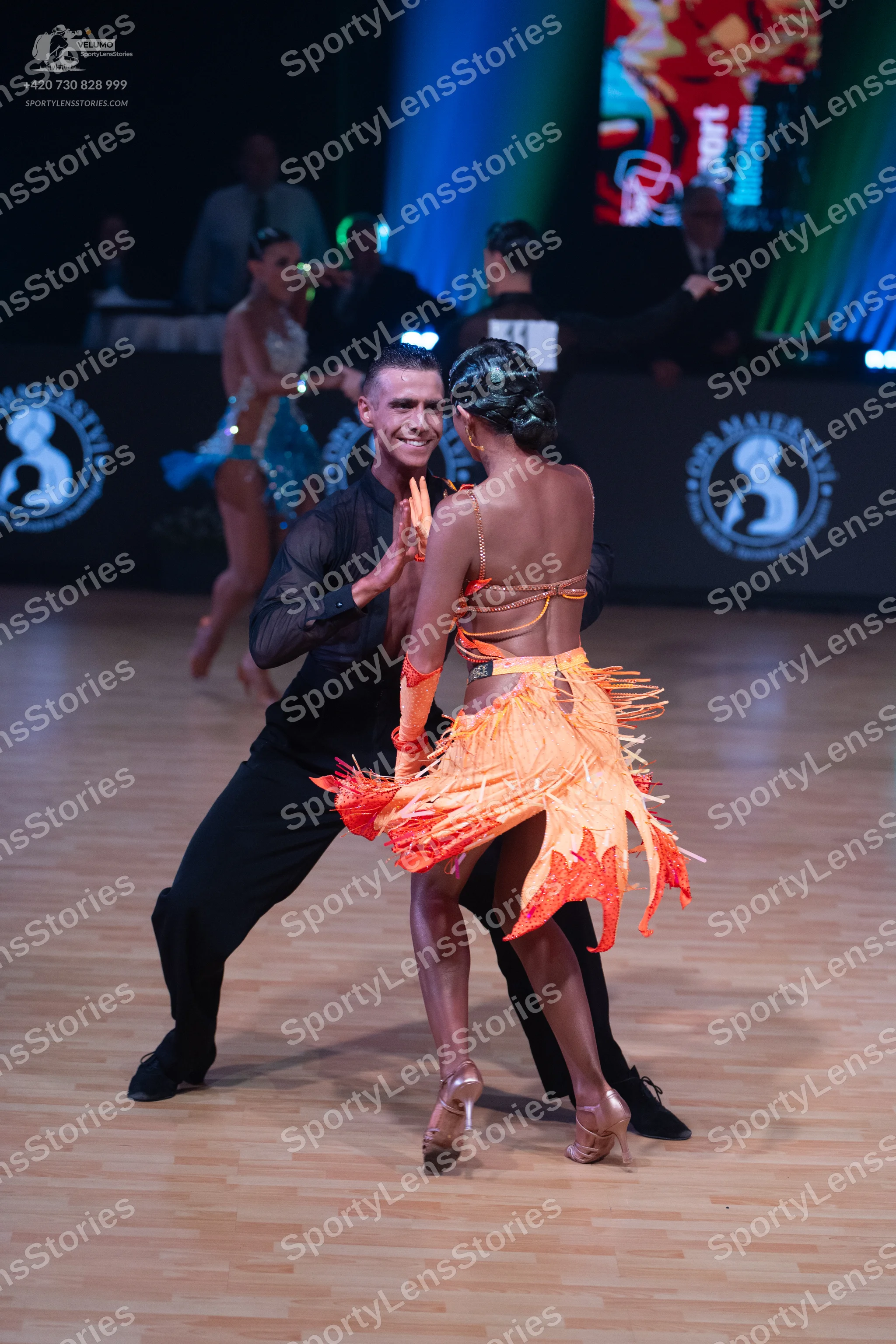 Dancesport competitor: Male dancer: black long-sleeved shirt and black trousers