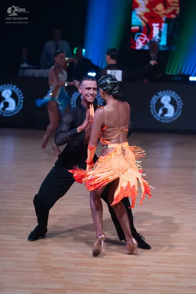 Dancesport competitor: Male dancer: black long-sleeved shirt and black trousers